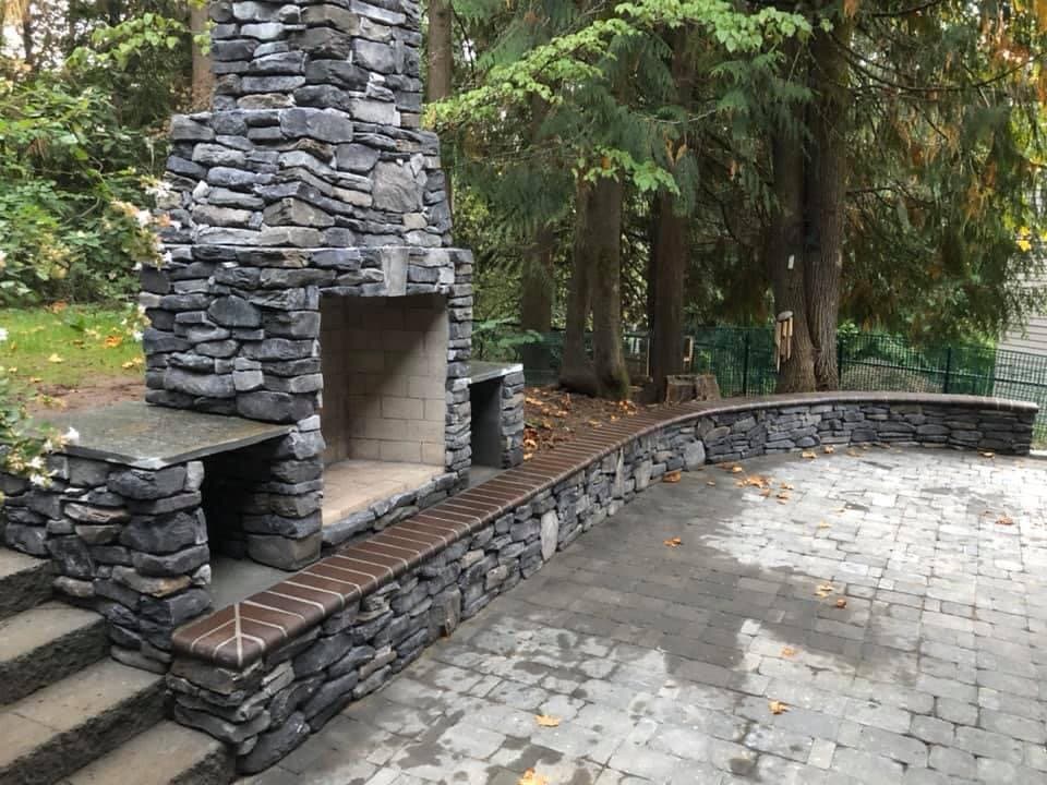 Outdoor stone fireplace by 4 Belt Concrete Portland OR